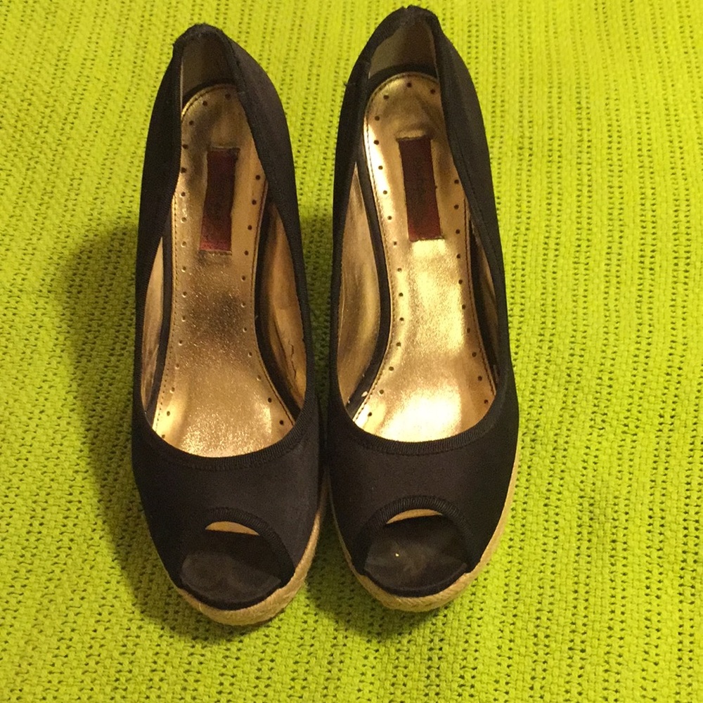 A pair of satin black platform espadrilles